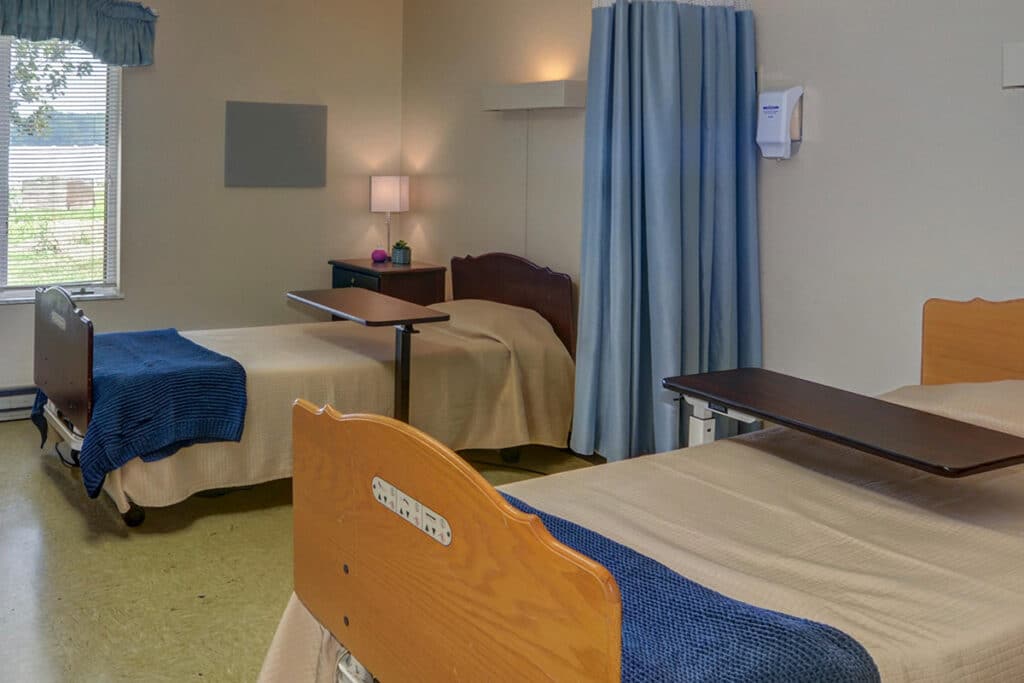 A semi-private bed room at Unger Park Post Acute